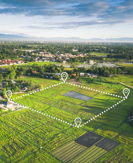 A green field with future building points plotted out