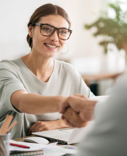 Woman shaking hands with someone