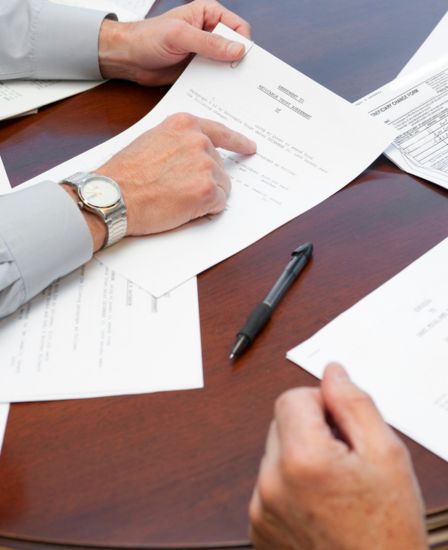 Two people reviewing documents