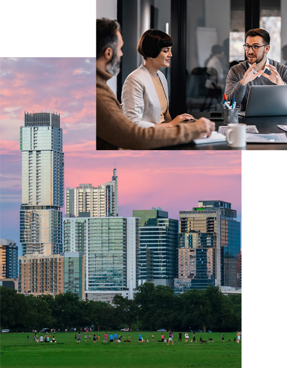 People having a work meeting around a table set on top of the Austin skyline